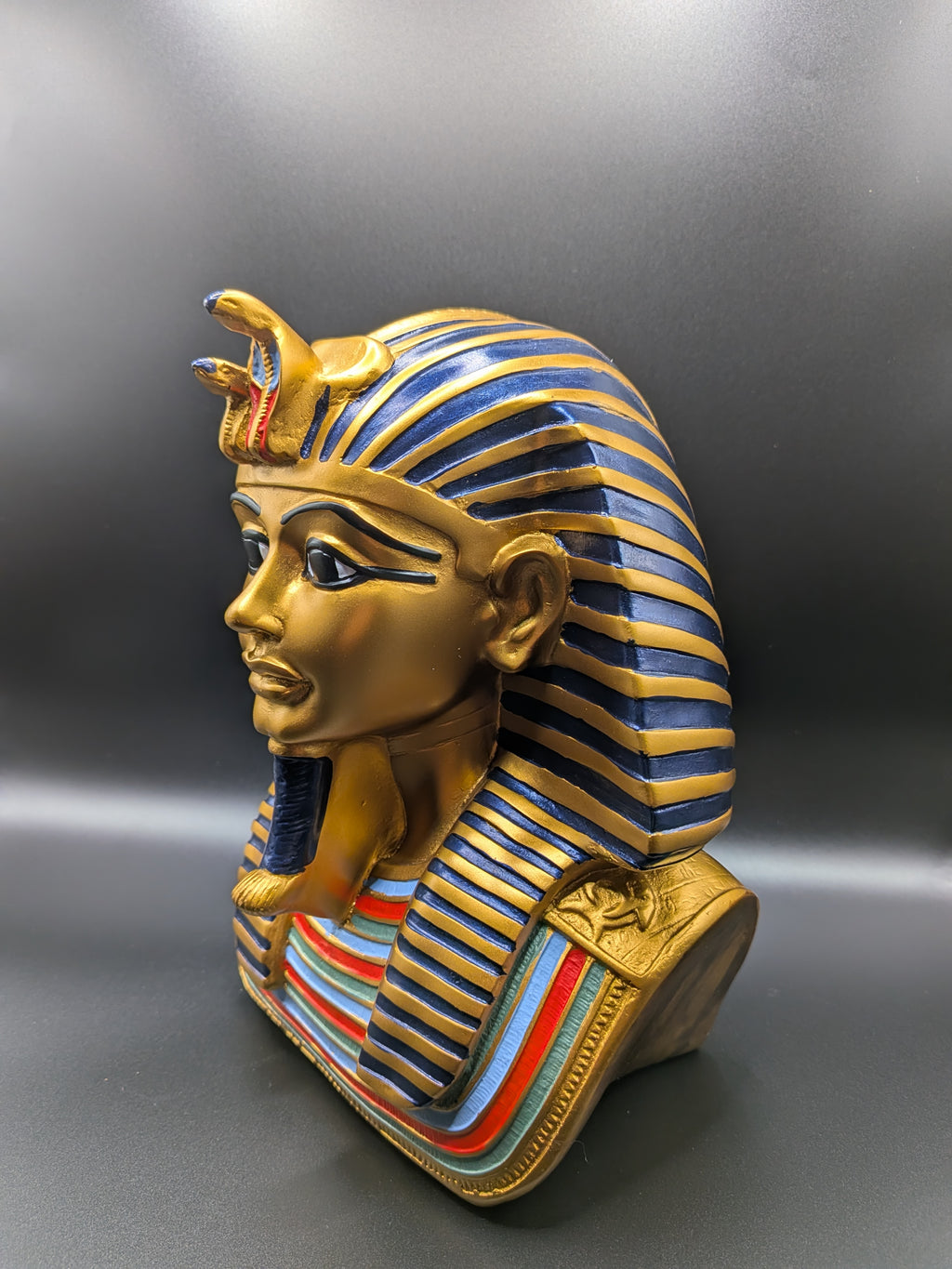 Decorative wall mask with Egyptian pharaoh design on a gray background